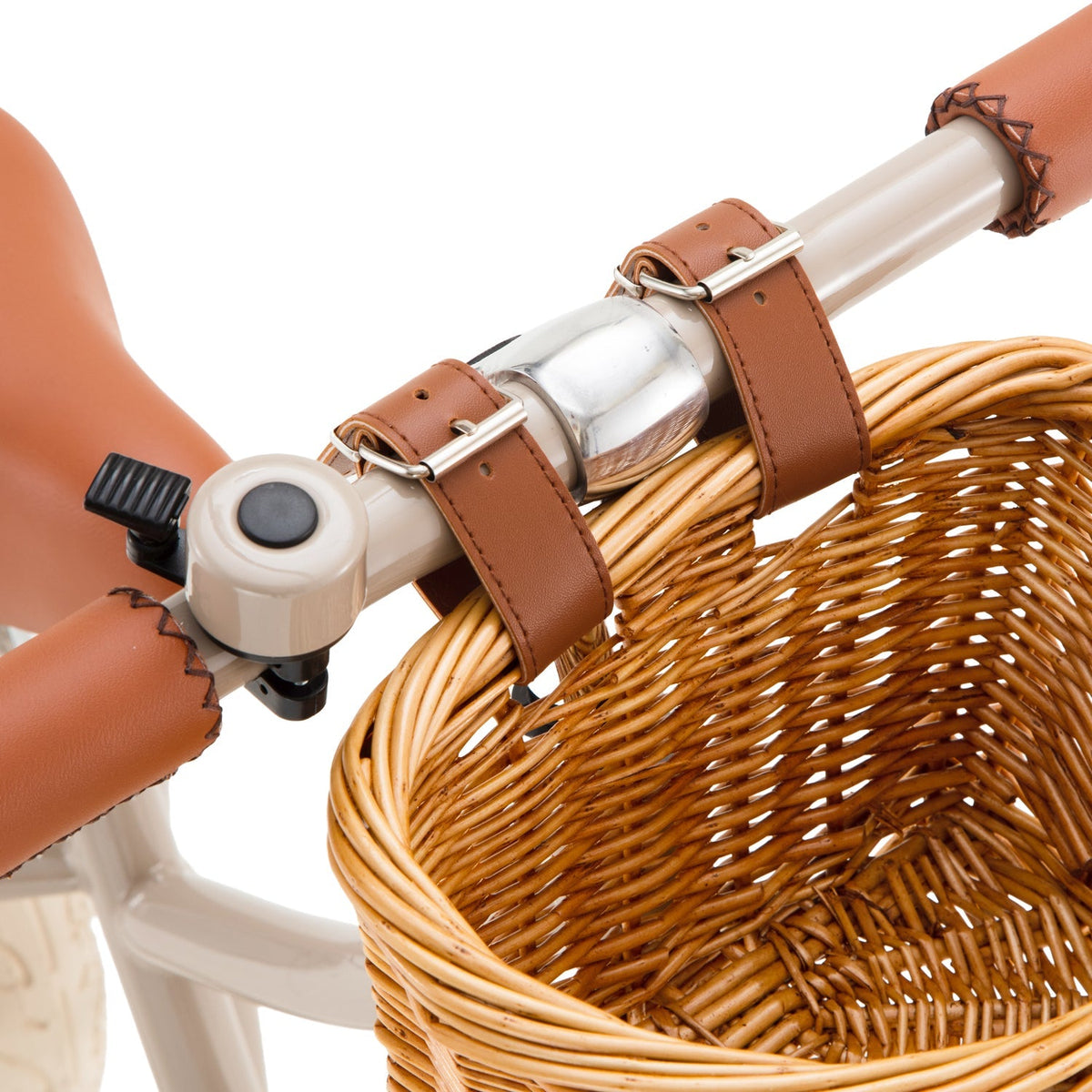 Toddler riding the Banwood Balance Bike Cream