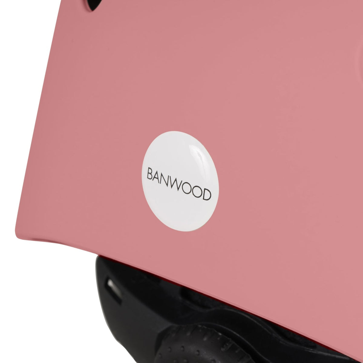 Kid wearing Banwood Eco Helmet Raspberry